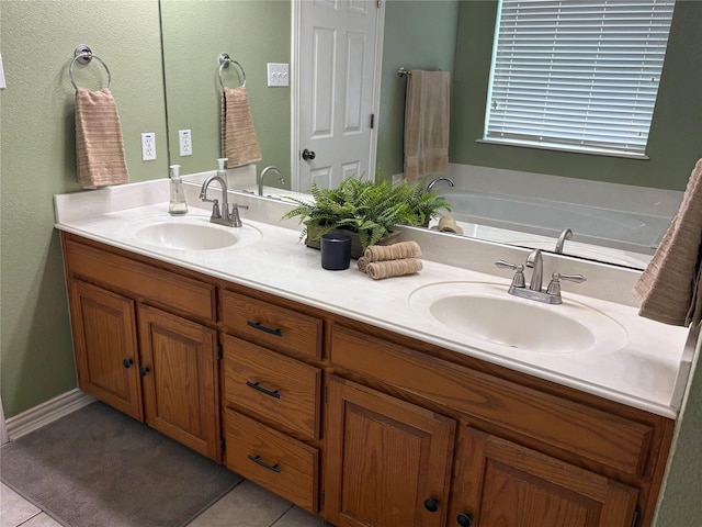 702 John Thomas Dr, Keene, TX 76059 - full bath featuring double vanity, tile patterned flooring, and a bath