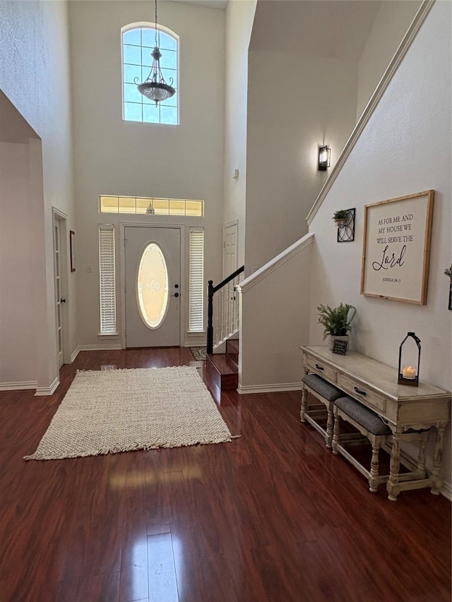 702 John Thomas Dr, Keene, TX 76059 - entrance foyer with wood finished floors, stairs, baseboards, and a high ceiling