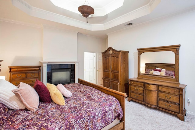 1991 Saint Andrews Dr, Red Oak, TX 75154 - bedroom featuring a raised ceiling, light colored carpet, ornamental molding, and a fireplace