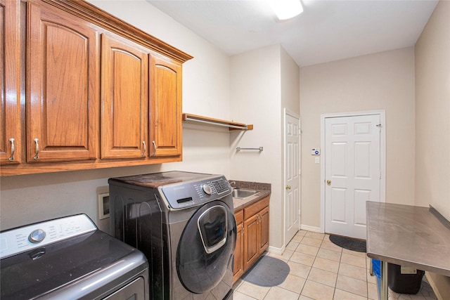 1991 Saint Andrews Dr, Red Oak, TX 75154 - washroom featuring cabinet space, washing machine and clothes dryer, light tile patterned flooring, and baseboards