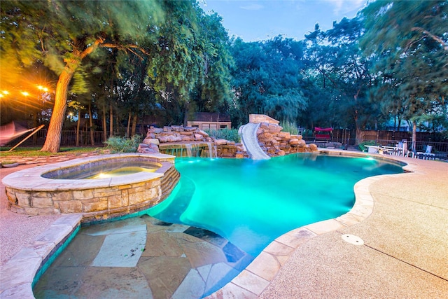 1991 Saint Andrews Dr, Red Oak, TX 75154 - view of pool with a water slide, a patio, and a pool with connected hot tub