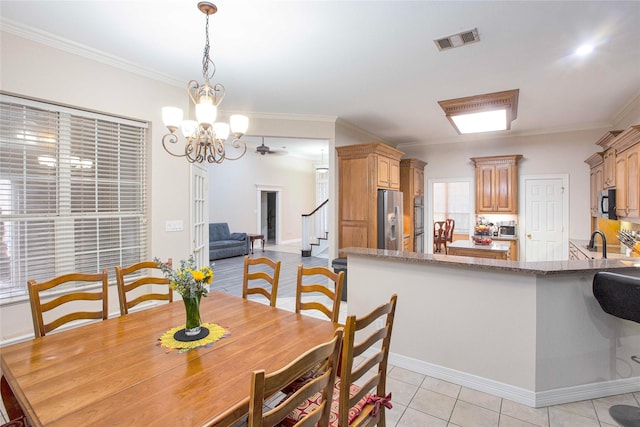 1991 Saint Andrews Dr, Red Oak, TX 75154 - dining room with a chandelier, stairway, crown molding, light tile patterned floors, and baseboards