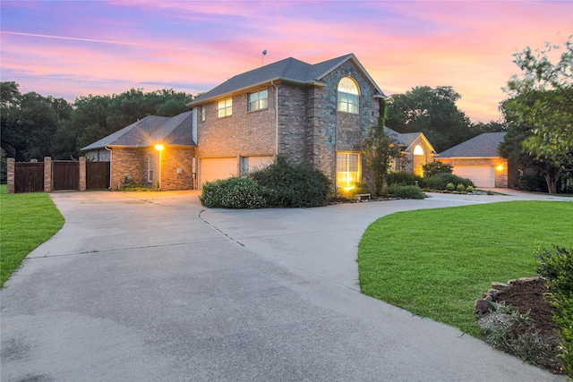1991 Saint Andrews Dr, Red Oak, TX 75154 - traditional-style house with curved driveway, brick siding, and a garage