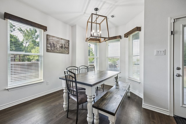 601 S 4th St, Crandall, TX 75114 - dining room featuring a chandelier, dark wood-type flooring, and baseboards