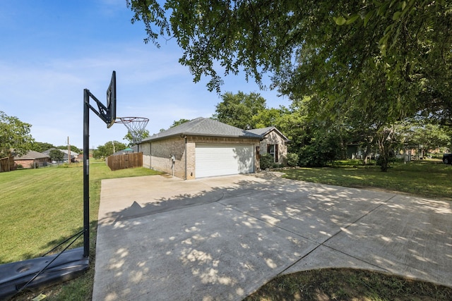 601 S 4th St, Crandall, TX 75114 - view of side of property featuring driveway, a garage, and brick siding