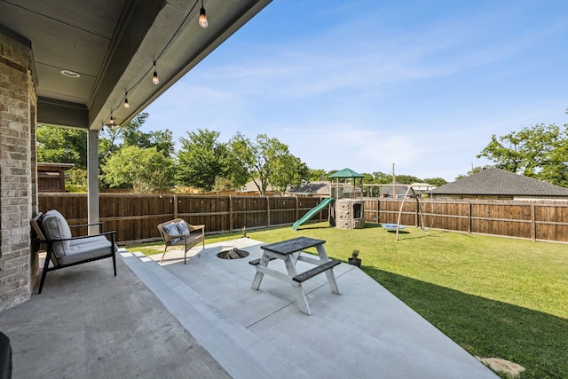 601 S 4th St, Crandall, TX 75114 - view of patio / terrace with a playground and a fire pit