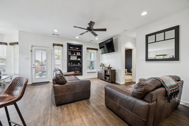 601 S 4th St, Crandall, TX 75114 - living room featuring wood finished floors, built in features, ceiling fan, and recessed lighting