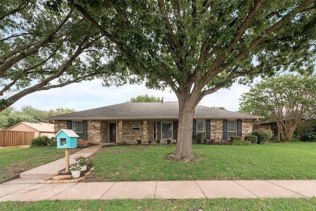 3410 Queenswood Ln, Garland, TX 75040 - single story home with a front lawn, brick siding, and a shingled roof