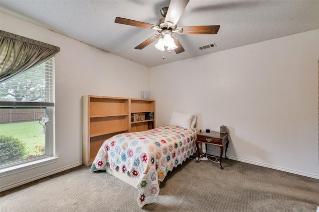 3410 Queenswood Ln, Garland, TX 75040 - bedroom featuring carpet, a ceiling fan, baseboards, and a textured ceiling