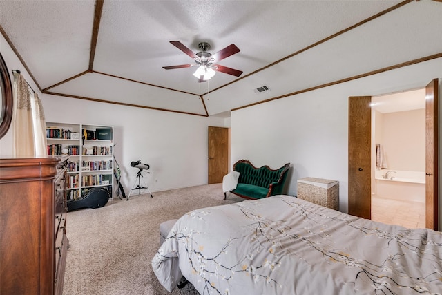 3410 Queenswood Ln, Garland, TX 75040 - bedroom with carpet flooring, vaulted ceiling, a textured ceiling, a ceiling fan, and ensuite bathroom