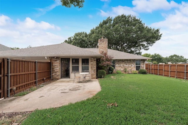 3410 Queenswood Ln, Garland, TX 75040 - back of house featuring brick siding, a chimney, a patio area, and a shingled roof