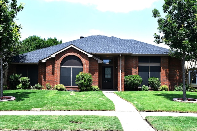 2906 Kingswood Dr, Garland, TX 75040 - ranch-style home with brick siding, a front lawn, and roof with shingles