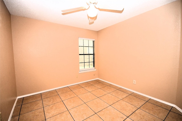 2906 Kingswood Dr, Garland, TX 75040 - unfurnished room with a ceiling fan, light tile patterned floors, and baseboards