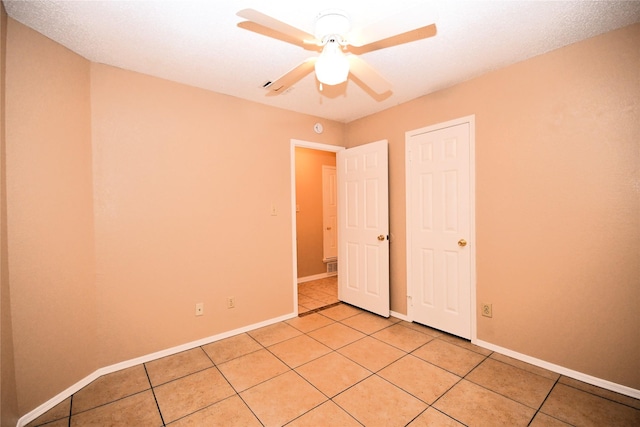 2906 Kingswood Dr, Garland, TX 75040 - unfurnished bedroom featuring light tile patterned floors, baseboards, and ceiling fan