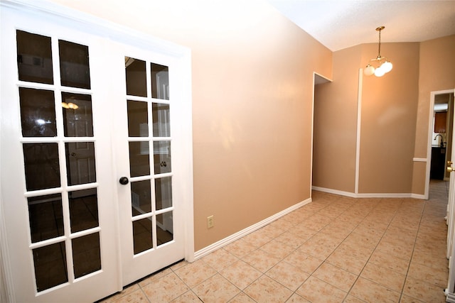 2906 Kingswood Dr, Garland, TX 75040 - spare room featuring tile patterned flooring, baseboards, and french doors