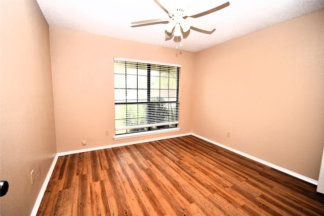 2906 Kingswood Dr, Garland, TX 75040 - unfurnished room with baseboards, a ceiling fan, and wood finished floors