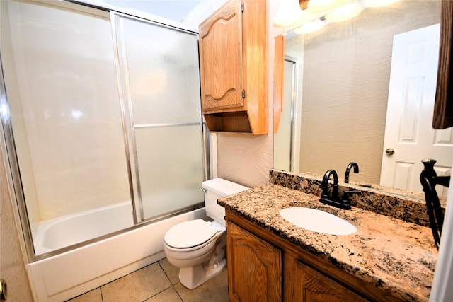 2906 Kingswood Dr, Garland, TX 75040 - full bathroom with vanity, toilet, enclosed tub / shower combo, and tile patterned floors