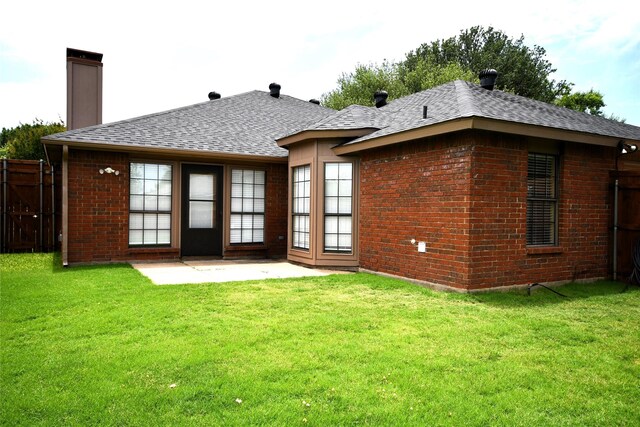 2906 Kingswood Dr, Garland, TX 75040 - back of house featuring brick siding, a shingled roof, a chimney, and a patio