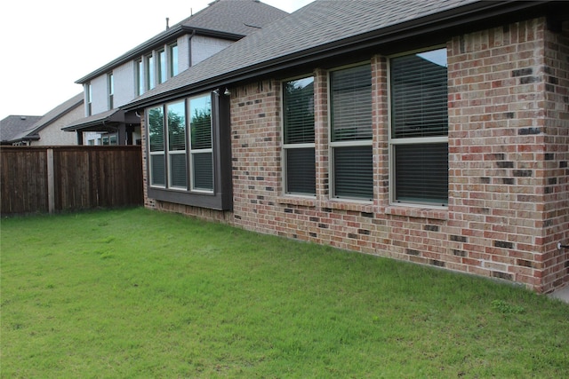 608 Remington Rd, Celina, TX 75009 - view of home's exterior with brick siding and roof with shingles