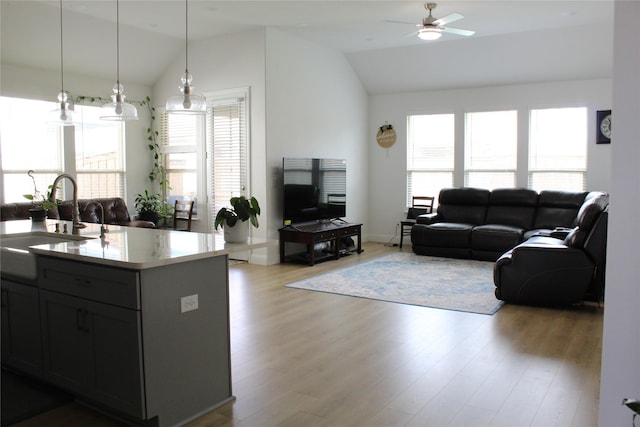 608 Remington Rd, Celina, TX 75009 - living room with lofted ceiling, healthy amount of natural light, a ceiling fan, and wood finished floors