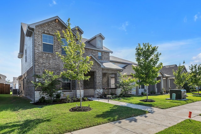 201 Olympus St, Wylie, TX 75098 - view of front of home with brick siding, a front lawn, and central air condition unit