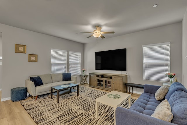 201 Olympus St, Wylie, TX 75098 - living area with ceiling fan, light wood-style floors, and baseboards