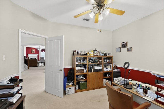 848 Ridge Point Dr, Grand Prairie, TX 75052 - home office with a ceiling fan, carpet floors, and arched walkways