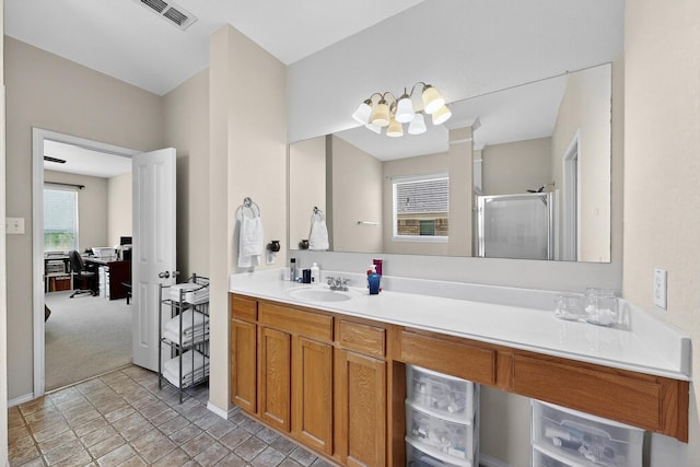 848 Ridge Point Dr, Grand Prairie, TX 75052 - bathroom featuring a chandelier, a stall shower, vanity, and stone finish flooring