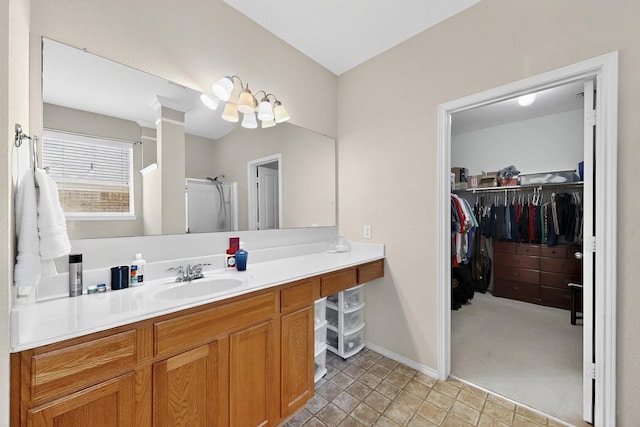 848 Ridge Point Dr, Grand Prairie, TX 75052 - bathroom featuring vanity, a spacious closet, and a shower