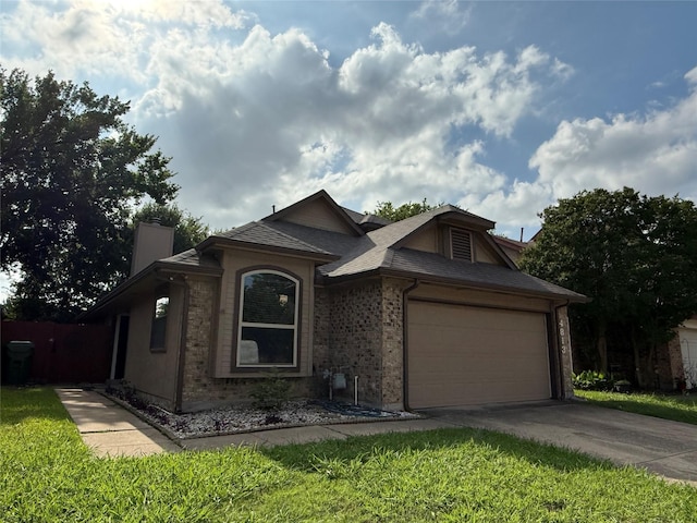4813 Tree Top Ln, Garland, TX 75044 - ranch-style home featuring concrete driveway, a garage, a chimney, and brick siding