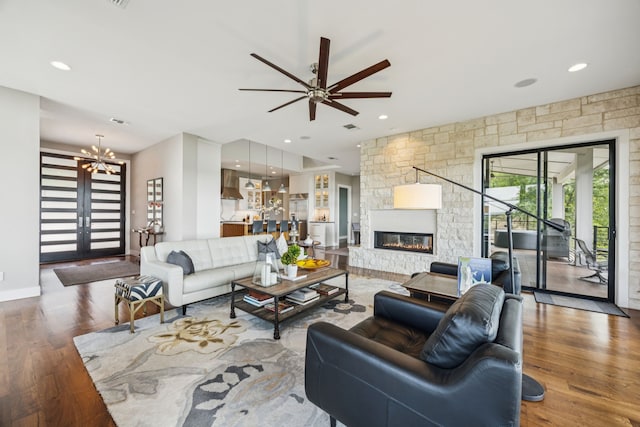 4003 Cheyenne Cir, Flower Mound, TX 75022 - living area with wood finished floors, a ceiling fan, a fireplace, a chandelier, and recessed lighting