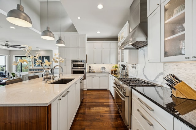 4003 Cheyenne Cir, Flower Mound, TX 75022 - kitchen featuring stainless steel appliances, a sink, range hood, recessed lighting, and ceiling fan