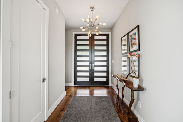 4003 Cheyenne Cir, Flower Mound, TX 75022 - foyer entrance featuring a chandelier, french doors, dark wood-type flooring, and baseboards