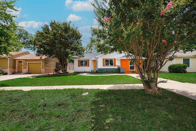 308 Chandler Dr, Garland, TX 75040 - single story home with concrete driveway, a front lawn, and an attached garage
