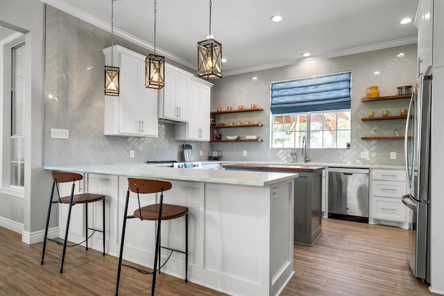 1310 Rolling Acres Dr, Argyle, TX 76226 - kitchen with stainless steel appliances, open shelves, a peninsula, ornamental molding, and tasteful backsplash