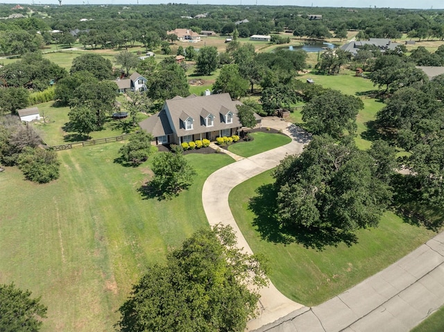 1310 Rolling Acres Dr, Argyle, TX 76226 - drone / aerial view of a tree filled landscape and a nearby body of water