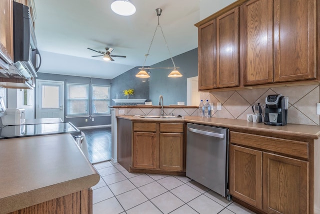 2111 Preston Trl, Forney, TX 75126 - kitchen featuring stainless steel appliances, a sink, brown cabinets, ceiling fan, and a peninsula