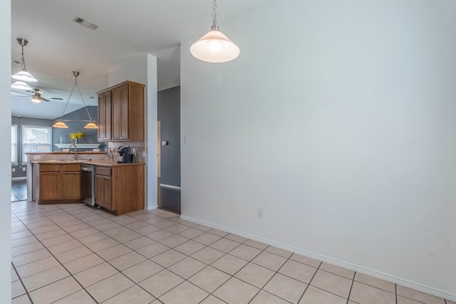 2111 Preston Trl, Forney, TX 75126 - kitchen with dishwasher, ceiling fan, hanging light fixtures, and light countertops