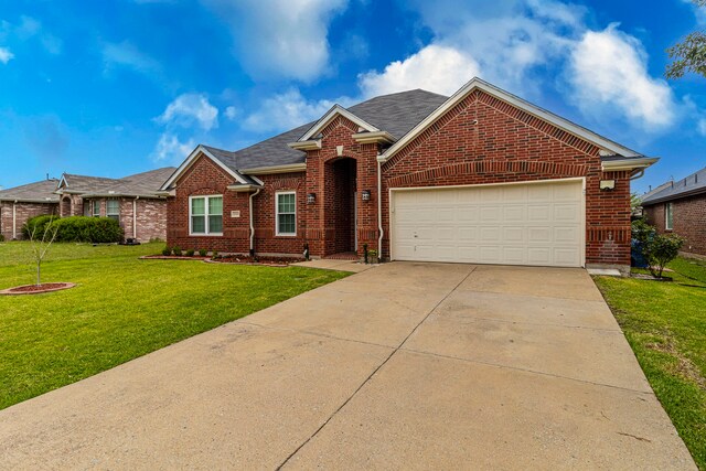 2111 Preston Trl, Forney, TX 75126 - traditional home featuring brick siding, a front yard, an attached garage, and driveway