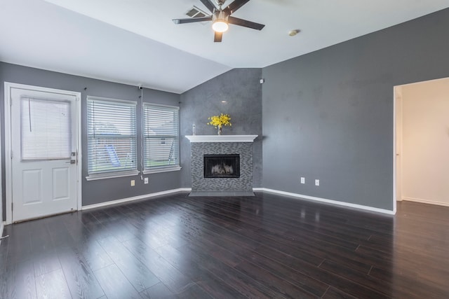2111 Preston Trl, Forney, TX 75126 - unfurnished living room with a ceiling fan, lofted ceiling, baseboards, a tile fireplace, and wood finished floors