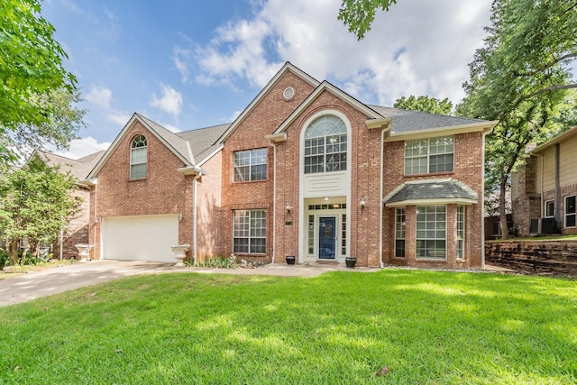 1803 Haydenbend Cir, Grapevine, TX 76051 - view of front facade with brick siding, a garage, concrete driveway, and a front yard