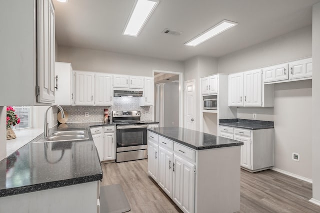 1803 Haydenbend Cir, Grapevine, TX 76051 - kitchen with appliances with stainless steel finishes, under cabinet range hood, a sink, and white cabinets
