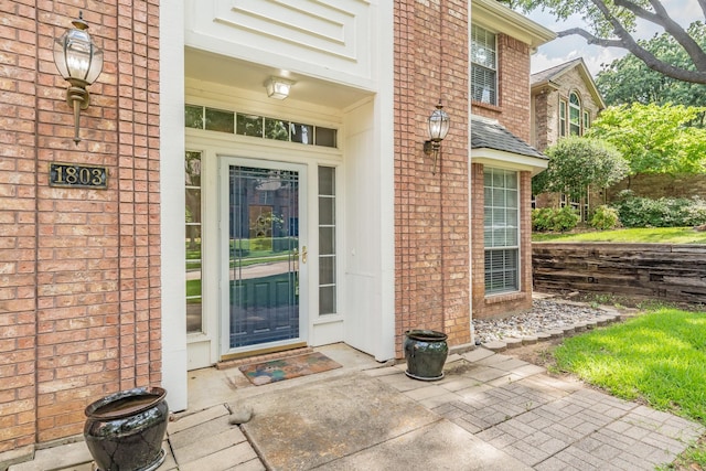 1803 Haydenbend Cir, Grapevine, TX 76051 - view of exterior entry with brick siding and a shingled roof
