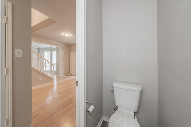 1803 Haydenbend Cir, Grapevine, TX 76051 - bathroom featuring wood finished floors, toilet, and baseboards
