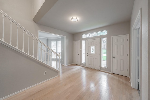 1803 Haydenbend Cir, Grapevine, TX 76051 - entrance foyer with stairway, light wood-style floors, healthy amount of natural light, and baseboards