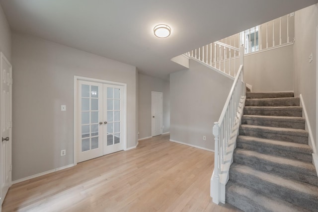 1803 Haydenbend Cir, Grapevine, TX 76051 - stairway featuring wood finished floors, french doors, and baseboards