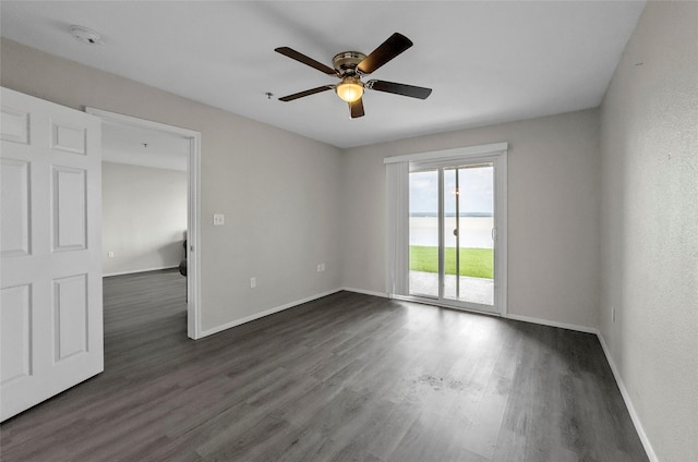 114 Harbor Dr Unit 117, Runaway Bay, TX 76426 - empty room with a ceiling fan, dark wood-style flooring, baseboards, and a smoke detector