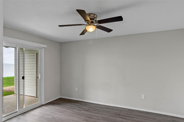 114 Harbor Dr Unit 117, Runaway Bay, TX 76426 - empty room featuring wood finished floors, baseboards, and ceiling fan