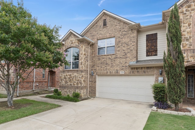 3711 Venice Dr, Irving, TX 75038 - townhome / multi-family property with an attached garage, driveway, and brick siding