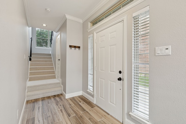 3711 Venice Dr, Irving, TX 75038 - entrance foyer featuring ornamental molding, baseboards, stairs, and light wood finished floors